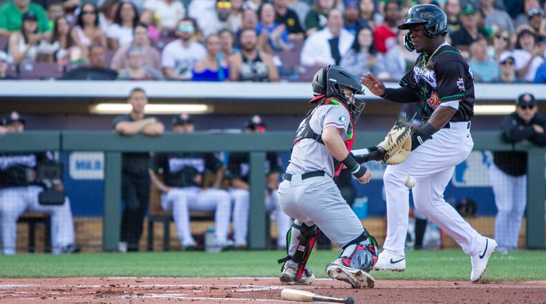 Dayton's Hector Rodriguez scores a run earlier this season at Day Air Ballpark. On Thursday night, Rodriguez collected the game-winning hit. Jeff Gilbert/CONTRIBUTED
