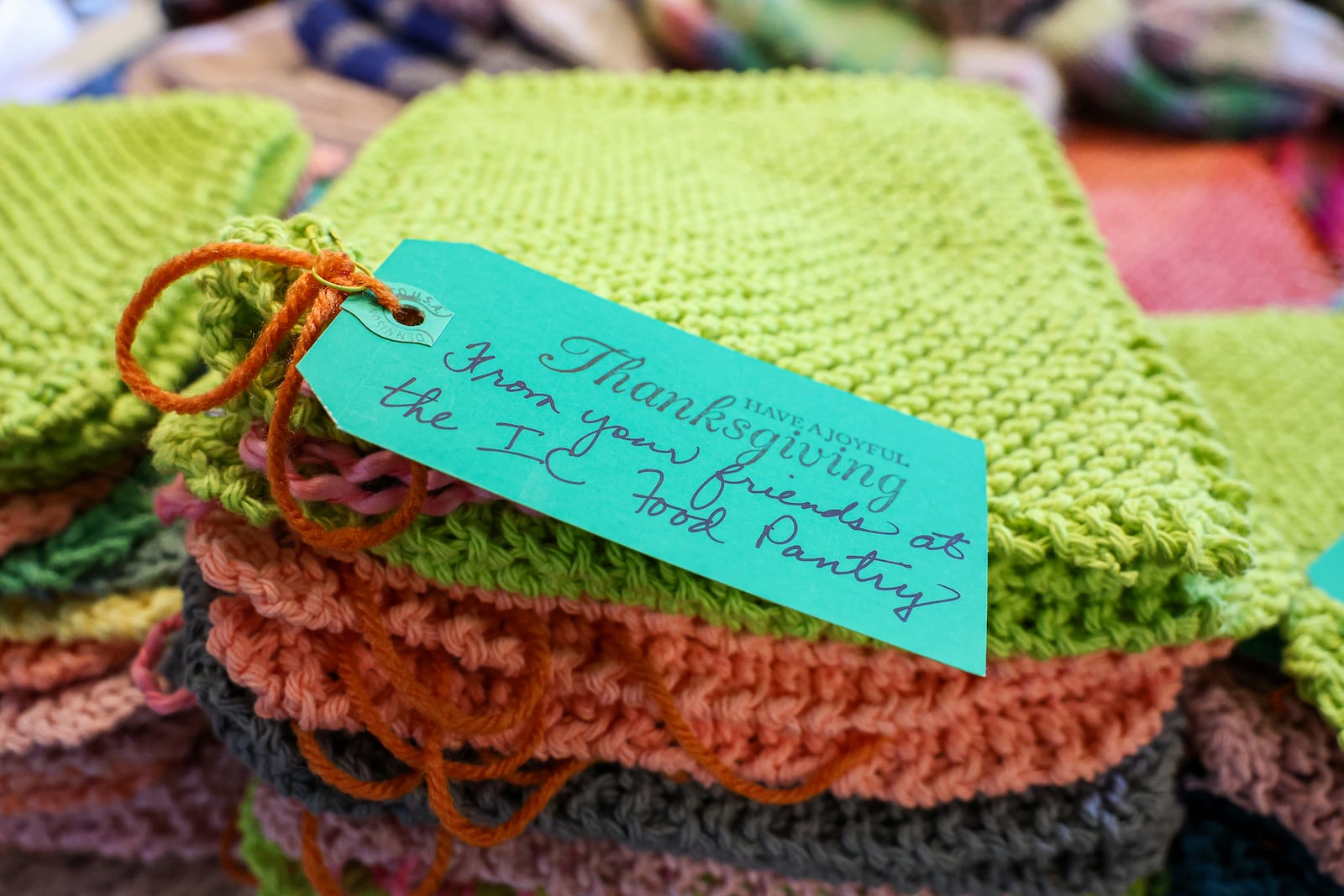 A photo of a washcloth made by Mary Gaier on July 21, 2025. The note attached reads, "Have a joyful Thanksgiving. From your friends at the IC Food Pantry." BRYANT BILLING / STAFF