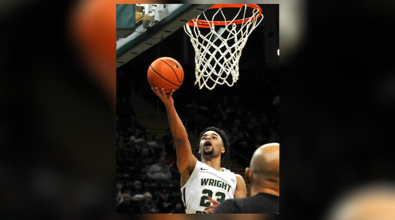 Wright State's Tanner Holden, 23, goes up for two points during the first half of a nonconference game against visiting Miami University on Tuesday, Dec. 19. DAVID A. MOODIE/CONTRIBUTING PHOTOGRAPHER