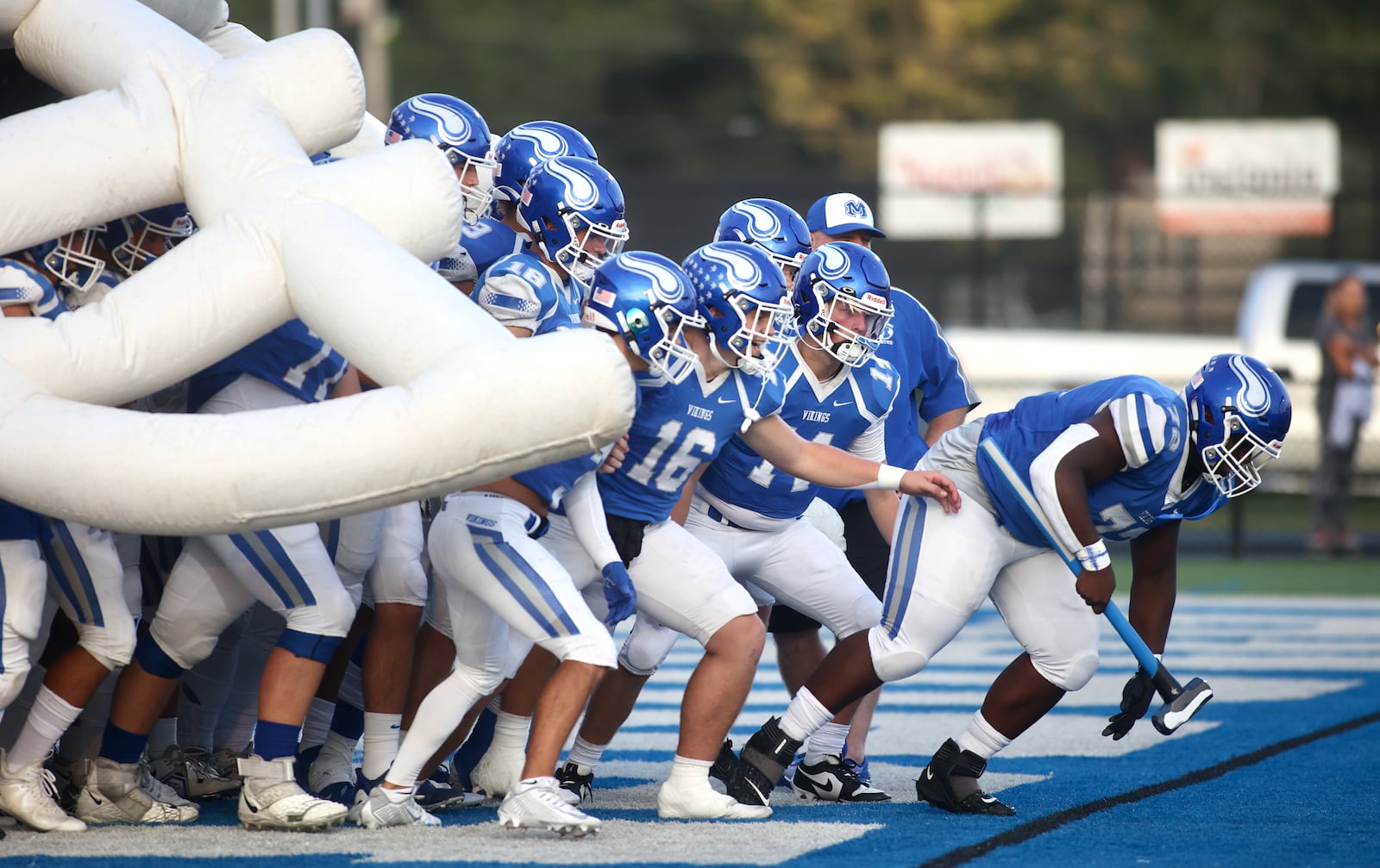 Miamisburg's Abel Ngoh leads the team onto the field before a game against Fairmont on Friday, Sept. 29, 2023, in Miamisburg. DAVID JABLONSKI / STAFF PHOTO