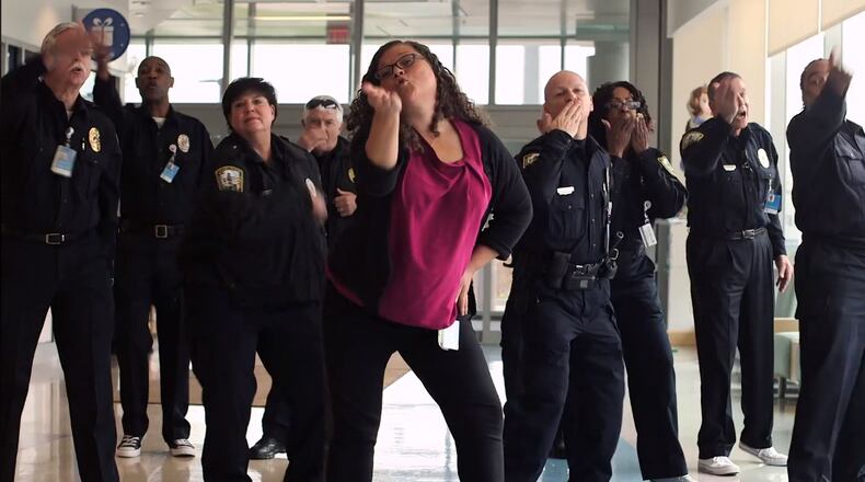 Stacey Adidou, a Cincinnati Children’s senior administrative assistant, leads a dance she choreographed during Cincinnati Children’s Hospital Medical Center’s “Can’t Stop the Healing” Holiday Video.