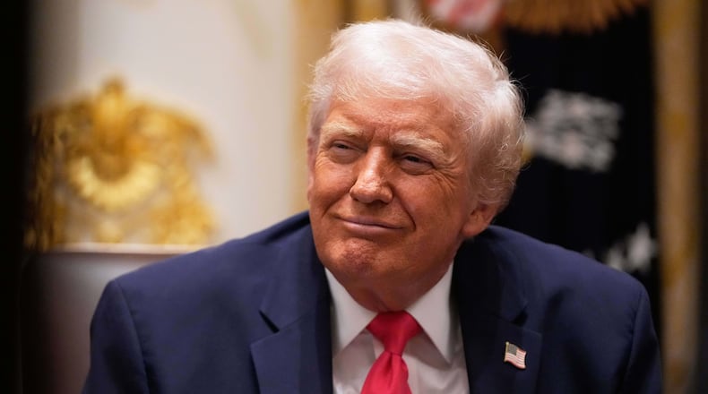 President Donald Trump listens during a Cabinet meeting at the White House, Tuesday, Dec. 2, 2025, in Washington. (AP Photo/Julia Demaree Nikhinson)