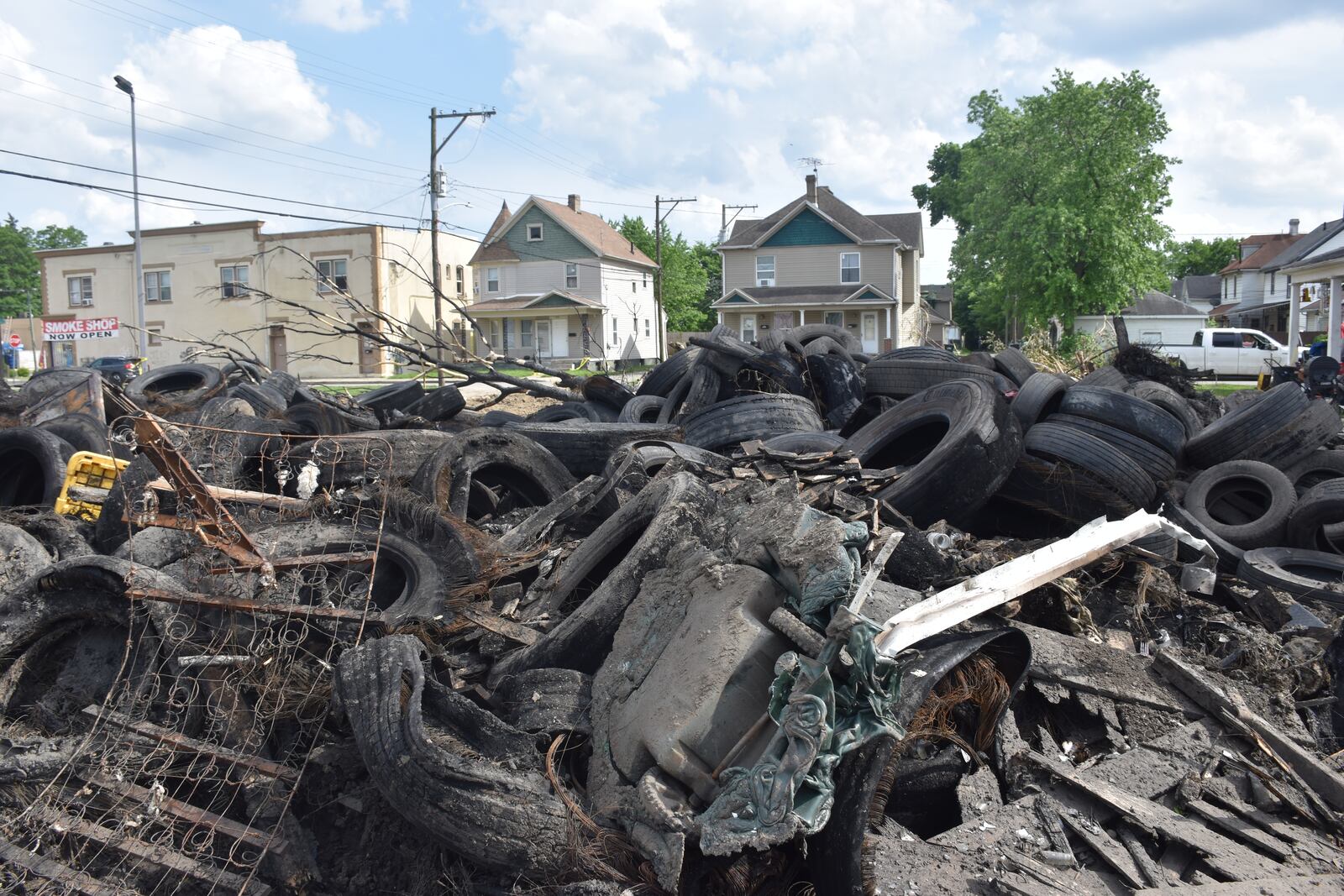 A mound of scrap tires on the 1400 block of Leonhard Street in Old North Dayton. The tire pile caught fire on May 20, 2024. CORNELIUS FROLIK / STAFF