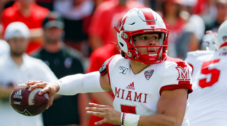 FILE - Miami (Ohio) quarterback Brett Gabbert looks to throw a pass during the first half of an NCAA college football game against Cincinnati in Cincinnati, Sept. 14, 2019. Gabbert is the younger brother of Blaine Gabbert, who is Tom Brady's backup in Tampa Bay and was the 10th overall draft pick by Jacksonville in 2011. The younger Gabbert has thrown for 1,475 yards and 15 touchdowns in the past four games. (AP Photo/John Minchillo, File)