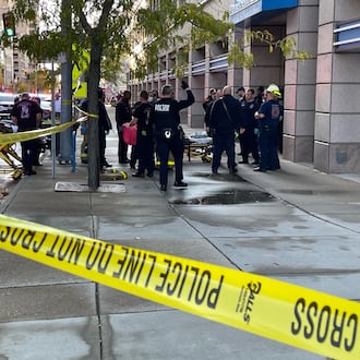 Three people were injured after Dayton firefighters responded to a fire alarm around 5 p.m. Saturday, Oct. 21, 2023, at the Premier Health building in the 100 block of North Main Street. One man was arrested after reportedly attacking a security guard and responding fire crews. PHOTO COURTESY LARRY PRICE