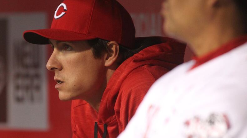 Reds pitcher Homer Bailey watches a game against the Cubs on Friday, April 22, 2016, at Great American Ball Park in Cincinnati. David Jablonski/Staff