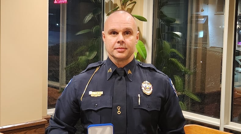 Sgt. Eddie Myers from the Monroe Police Department was presented the Distinguished Service Medal with Valor Tuesday night for his efforts in saving a woman's life after she drove into a retention pond off I-75 on Oct. 29, 2023. SUBMITTED PHOTO