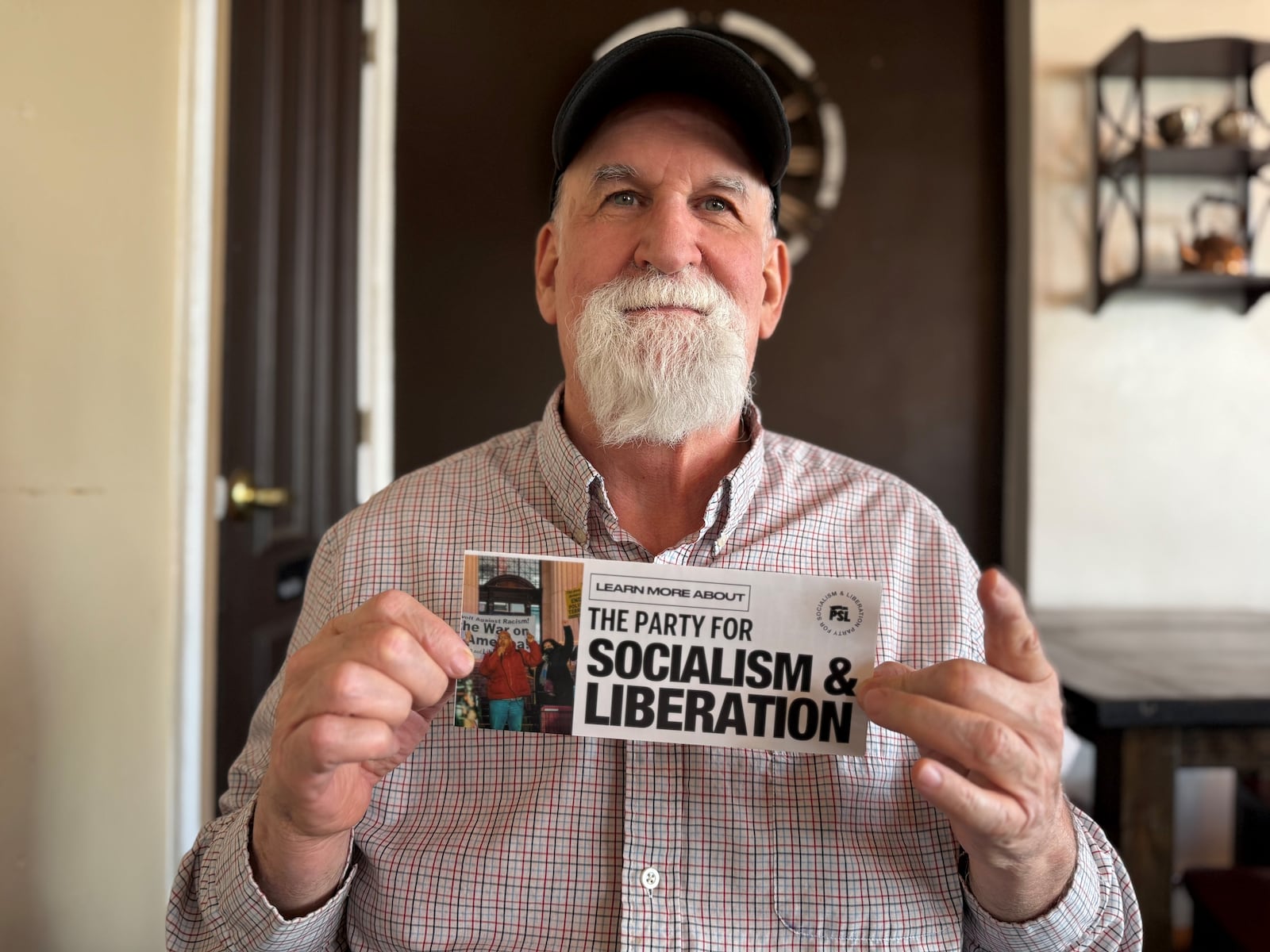Alec Johnson, 72, of Dayton, is a full member of the southwest Ohio branch of the Party for Socialism and Liberation. Johnson said he plans to take part in protests during the NATO Parliamentary Assembly events in downtown Dayton in late May. CORNELIUS FROLIK / STAFF