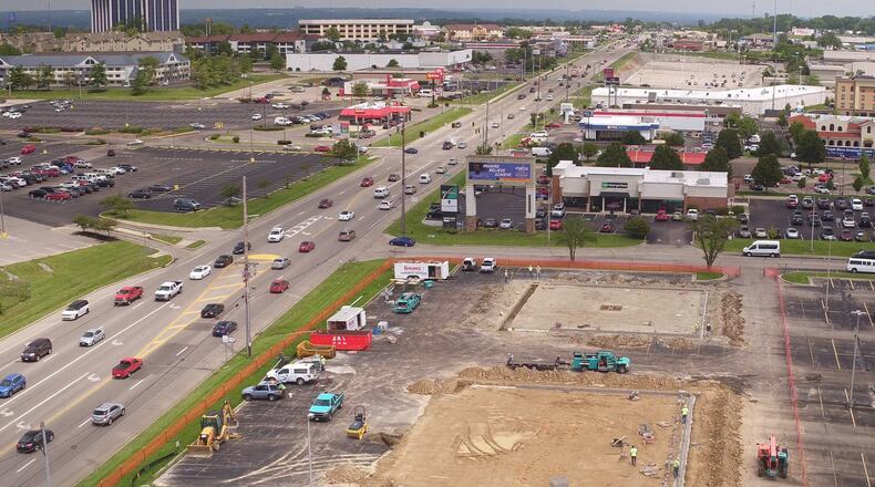 Construction of new retail space on Springobro Pike in Miami Township at Lyons Rd. Employers are saying the can’t find enough construction workers for the number of jobs available. TY GREENLEES / STAFF