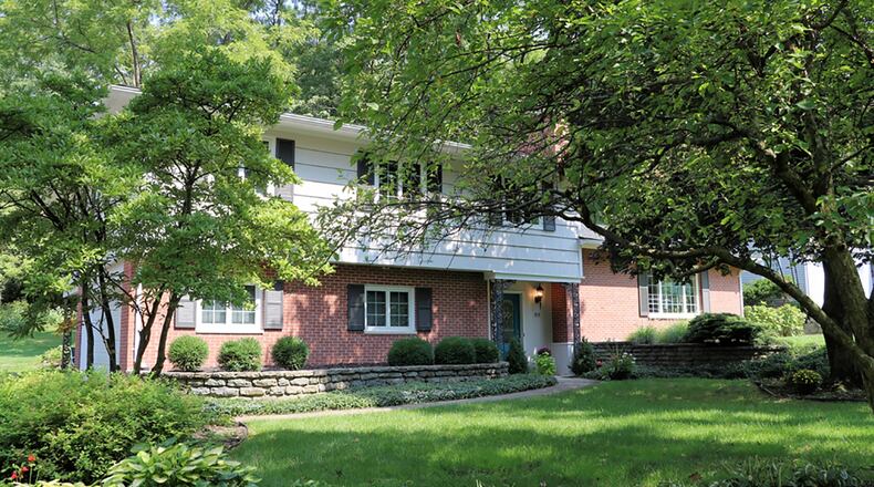 The brick-and-frame home has 4 bedrooms, 3 full baths and about 3,680 sq. ft. of living space. Each level offers spacious rooms in a flowing floor plan with two levels having access to the private, 0.62-acre back yard. CONTRIBUTED PHOTO BY KATHY TYLER
