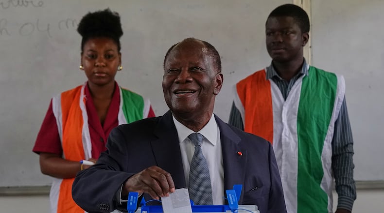 Ivory Coast President Alassane Ouattara casts his vote at a polling station during the presidential elections in Abidjan, Ivory Coast, Saturday, Oct. 25, 2025. (AP Photo/Misper Apawu)