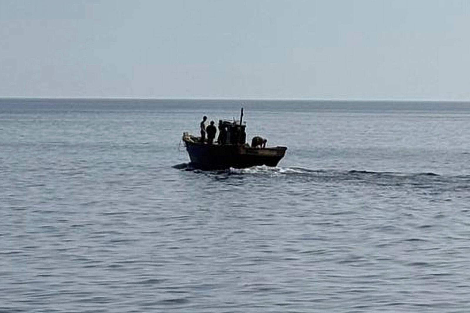 In this photo provided by South Korea Unification Ministry, a wooden boat carrying North Korean individuals move northward in the East Sea, South Korea, as South Korea sent the North Koreans back across their sea border, Wednesday, July 9, 2025. (South Korea Unification Ministry via AP)