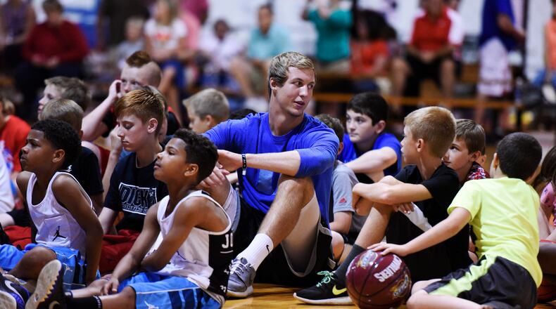Luke Kennard sits with “Air Kev” team players during a celebration for the players and parents June 5, 2015, at Kingdom Sports Center in Franklin. Kennard, basketball trainer Kevin “Air Kev” Duncan, rapper and motivational speaker L.G. Wise and the Kingdom crew spoke to the young basketball players and their families promoting good decisions and work ethics. NICK GRAHAM/STAFF