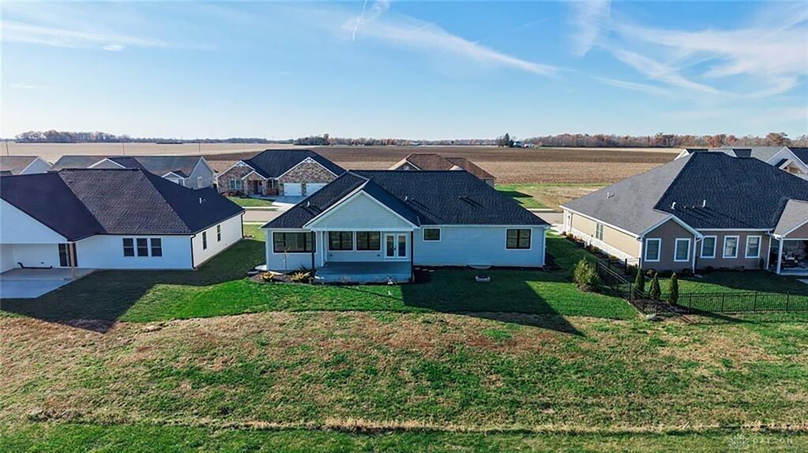 The back of the home has a covered patio and a brick/stone firepit. CONTRIBUTED