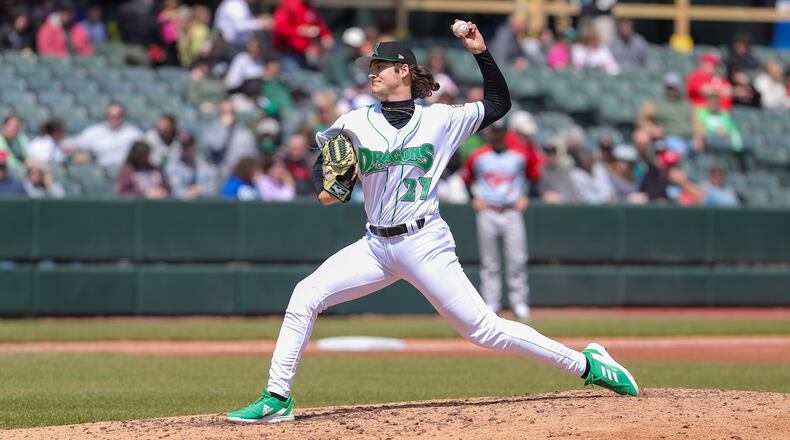Dayton Dragons pitcher Adam Serwinowski motions towards the plate during their game against the Fort Wayne TinCaps earlier this season at Day Air Ballpark. MICHAEL COOPER / STAFF
