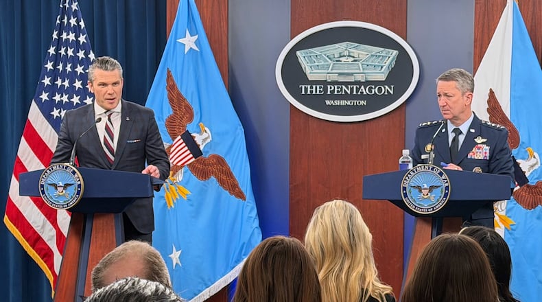 Defense Secretary Pete Hegseth and Chairman of the Joint Chiefs of Staff Gen. Dan Caine, speak during a press briefing at the Pentagon, Wednesday, March 4, 2026, in Washington. (AP Photo/Konstantin Toropin)