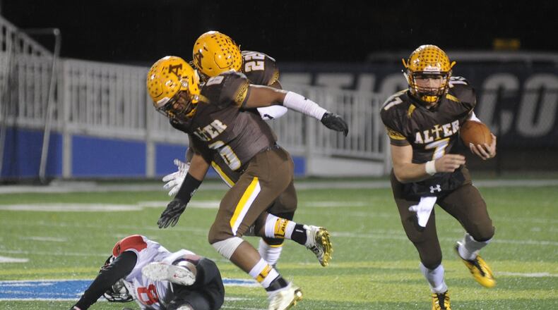 Alter’s Lamar Landers (6) and Branden McDonald (22) clear the way for Knights QB Connor Bazelak. Alter defeated Cin. Mt. Healthy 14-12 in a D-III, Region 12 quarterfinal high school football playoff game at Fairmont’s Roush Stadium on Friday, Nov. 2, 201. MARC PENDLETON / STAFF
