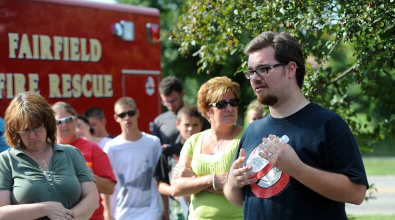 John Carter, 22, of Fairfield, speaks to people during a search operation for his fiancee, Katelyn Markham. FILE