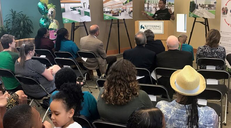 Rachel Blanks, DPS teacher and healthy food advocate, speaks at a presentation detailing the teaching kitchen planned at Gem City Market. KAITLIN SCHROEDER