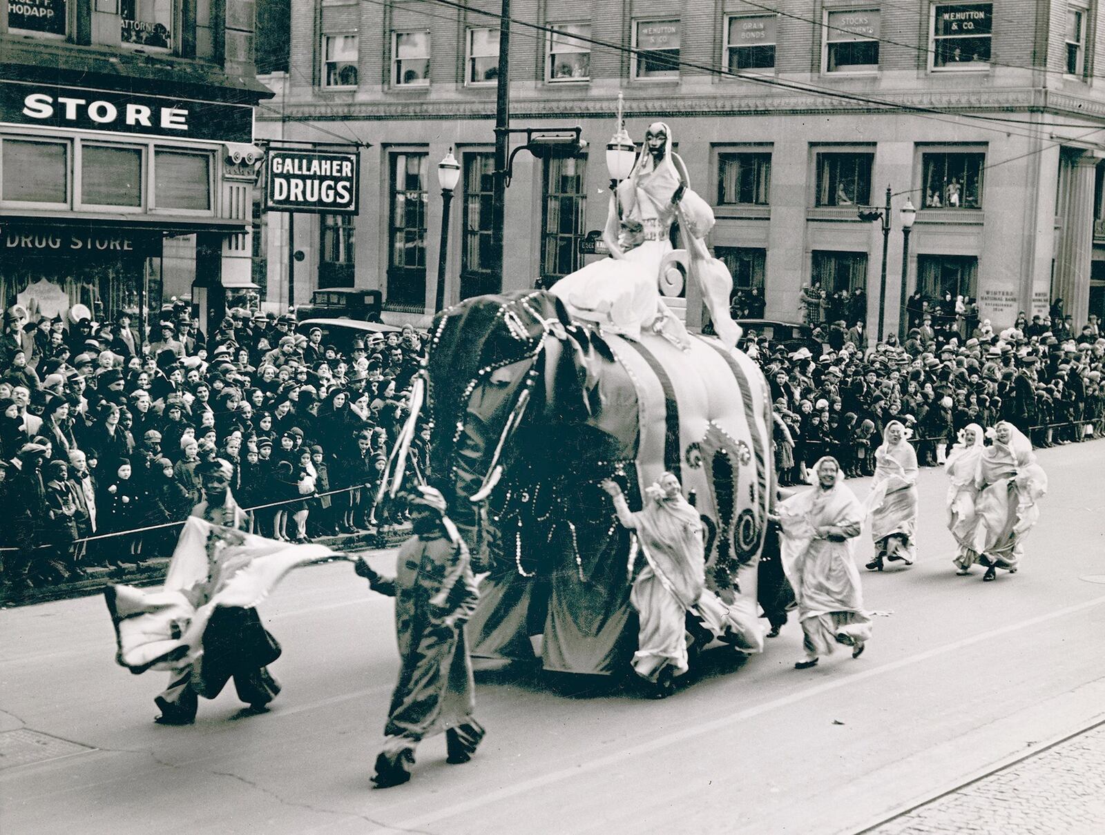 Princess Sari rides her royal elephant Jumbo through Dayton during the 1935 Rike’s Thanksgiving Day Parade. The elephant was propelled by four men underneath. PHOTO COURTESY OF THE OHIO HISTORY CONNECTION