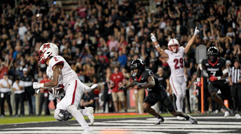 Miami (Ohio) defensive back Yahsyn McKee (2) makes an interception in the end zone during overtime in an NCAA college football game against Cincinnati, Saturday, Sept. 16, 2023, in Cincinnati. (AP Photo/Jeff Dean)