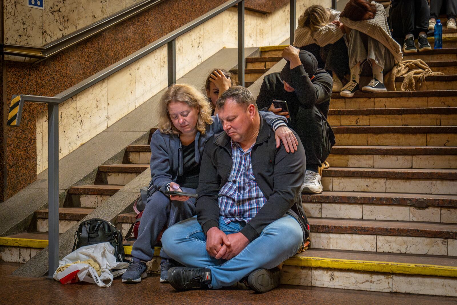 People rest in a metro station, being used as a bomb shelter, during a Russian drones attack in Kyiv, Ukraine, early Friday, June 6, 2025. (AP Photo/Dan Bashakov)