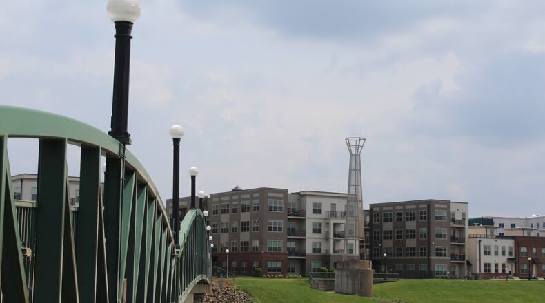 A view of the Water Street Flats from the opposite side of the pedestrian bridge near RiverScape MetroPark. CORNELIUS FROLIK / STAFF