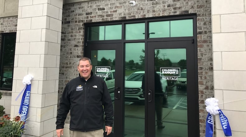 Managing Partner Ron Sweeney stands outside Coldwell Banker Heritage’s new office on Yankee Street.
