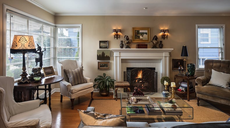 The flooring in the living room is original, as are the mantel and fireplace (though it s been converted to gas). Together, the decor represents an eclectic mix of stuff from over the years, Greg says: The new sofa is from Crate & Barrel, with antique sconces from their previous home, a table from Greg s late parents home and a reupholstered leopard footstool from a neighbor s garage sale. There are stories behind everything, he says. We re preserving them. (Steve Ringman/Seattle Times/TNS)
