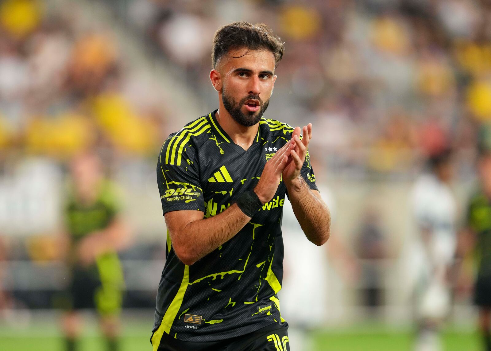 Columbus Crew forward Diego Rossi gestures to the crowd during the second half of an MLS soccer match against Vancouver Whitecaps, Saturday, June 14, 2025, in Columbus, Ohio. (AP Photo/Jeff Dean)
