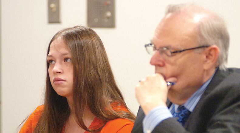 Brittany Pilkington appears for arraignment on three capital murder charges with her attorney Marc S. Triplett on Wednesday, Aug. 26, 2015, in Logan County Common Pleas Court in Bellefontaine, Ohio. Pilkington is charged with suffocating her three sons over a 13-month period. (Joel E. Mast/Bellefontaine Examiner via AP)