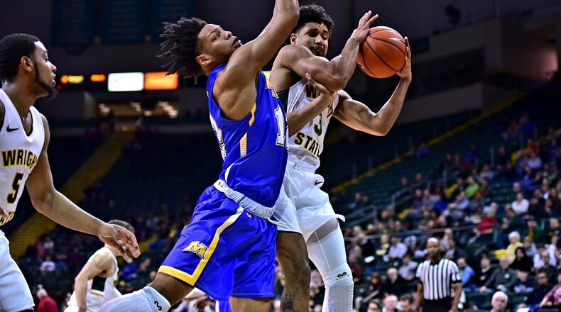 Wright State’s Mark Hughes pulls down a rebound against Morehead State on Tuesday, Dec. 18, 2018, at the Nutter Center. Joseph Craven/CONTRIBUTED