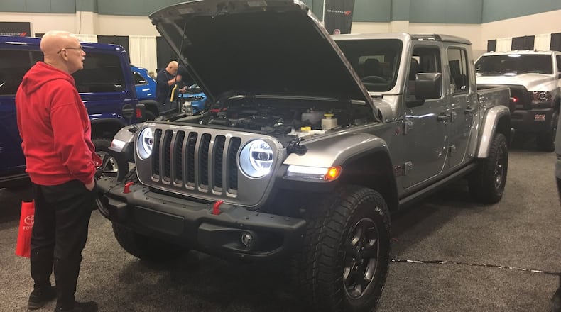 Dayton Auto Show participants look at new vehicles Thursday. STAFF PHOTO / HOLLY SHIVELY