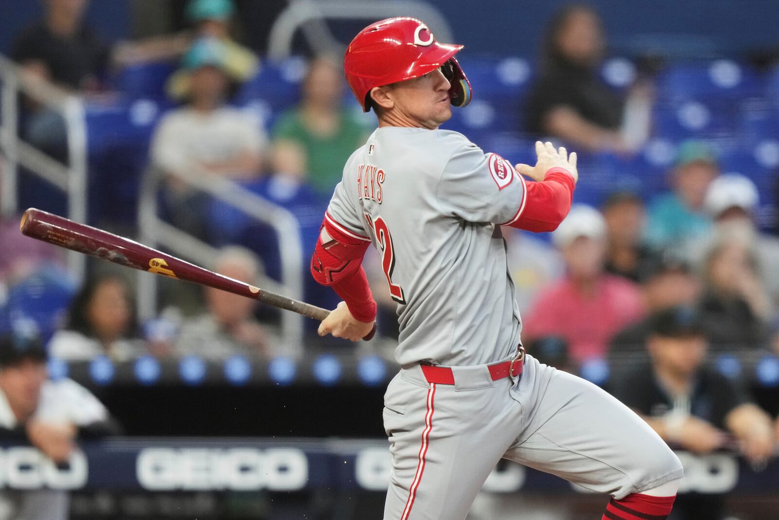 Cincinnati Reds' Austin Hays follows through on a single during the fourth inning of a baseball game against the Miami Marlins, Monday, April 21, 2025, in Miami. (AP Photo/Lynne Sladky)