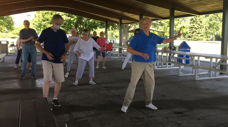Members of the Dynamic Dancers senior line dancing group practice their steps at Delco Park in Kettering on Friday, June 19. SARAH FRANKS/STAFF