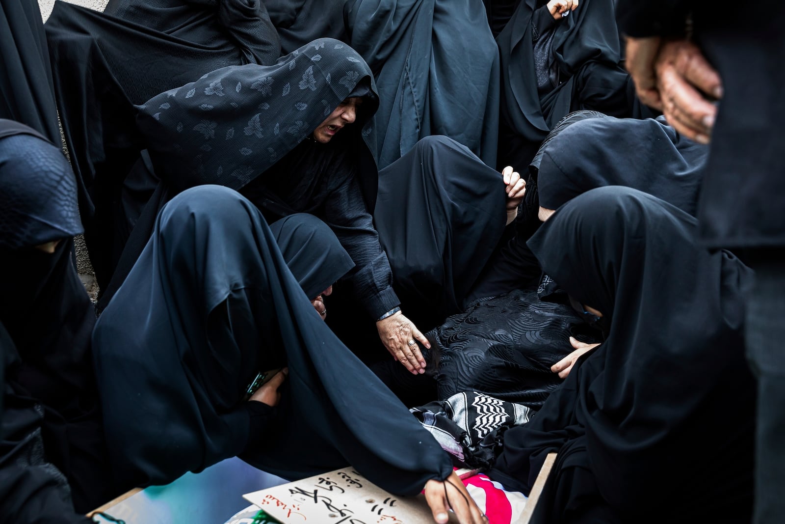Women mourn over the body of Mohammadi Javad Naseri, who was reportedly killed in Israeli strikes in the northwestern Iranian city of Tabriz, Monday, June 16, 2025. (AP Photo/Matin Hashemi)
