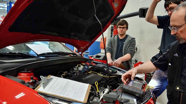General Motors ASEP students working with an oscilloscope in their Advanced Engine Performance course before they graduate this May and return to their dealerships. Photo contributed by Sinclair Community College