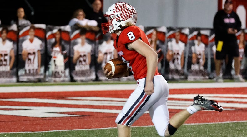 Tipp's Carson Robbins carries the ball in for a touchdown after picking up a Trotwood fumble during the Friday, Nov. 4, 2022, game. BILL LACKEY/STAFF