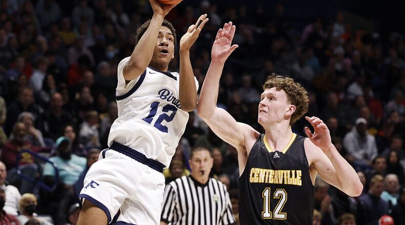 Kettering Fairmont's Anthony Johnson puts up a shot over Centerville's Tom House during their Division I regional basketball game Wednesday, March 9, 2022 at Cintas Center on the Xavier University campus in Cincinnati. NICK GRAHAM/STAFF