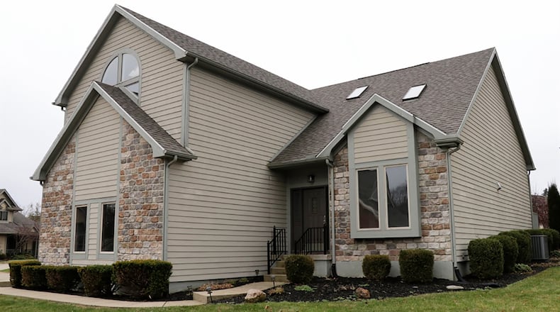 The brick-and-cedar home has about 3,570 sq. ft. of living space, including the finished basement. The house is located within The Woods of Beavercreek community where residents have the use of a clubhouse, tennis courts, walking paths and common areas. CONTRIBUTED PHOTO BY KATHY TYLER