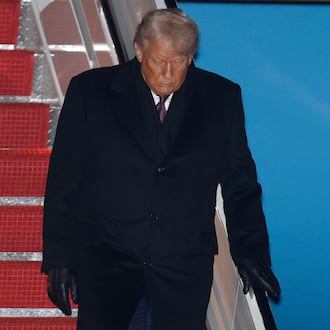 President Donald Trump walks down the stairs of Air Force One upon his arrival at Joint Base Andrews, Md., Thursday, Jan. 22, 2026, after returning from the World Economic Forum in Davos.(AP Photo/Luis M. Alvarez)