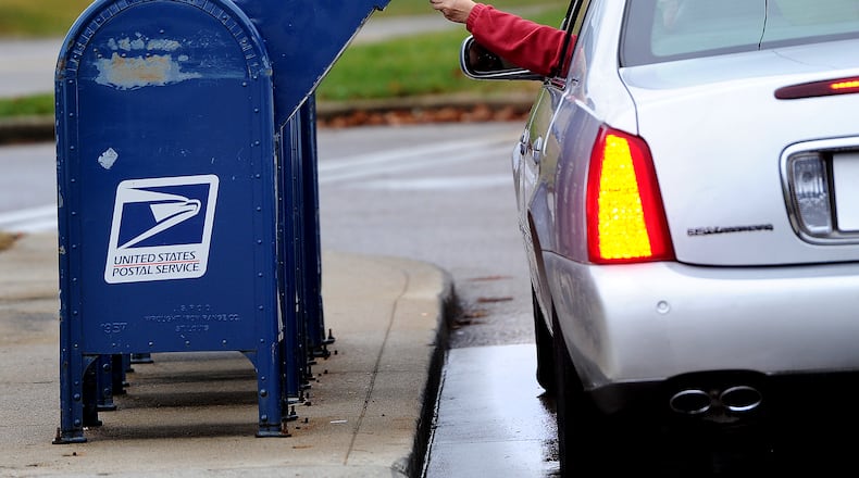 The Beavercreek Police Department is warning residents against using blue mailboxes when mailing items such as cash or checks after receiving reports of thefts from the collection boxes outside U.S. Post Offices. MARSHALL GORBY\STAFF