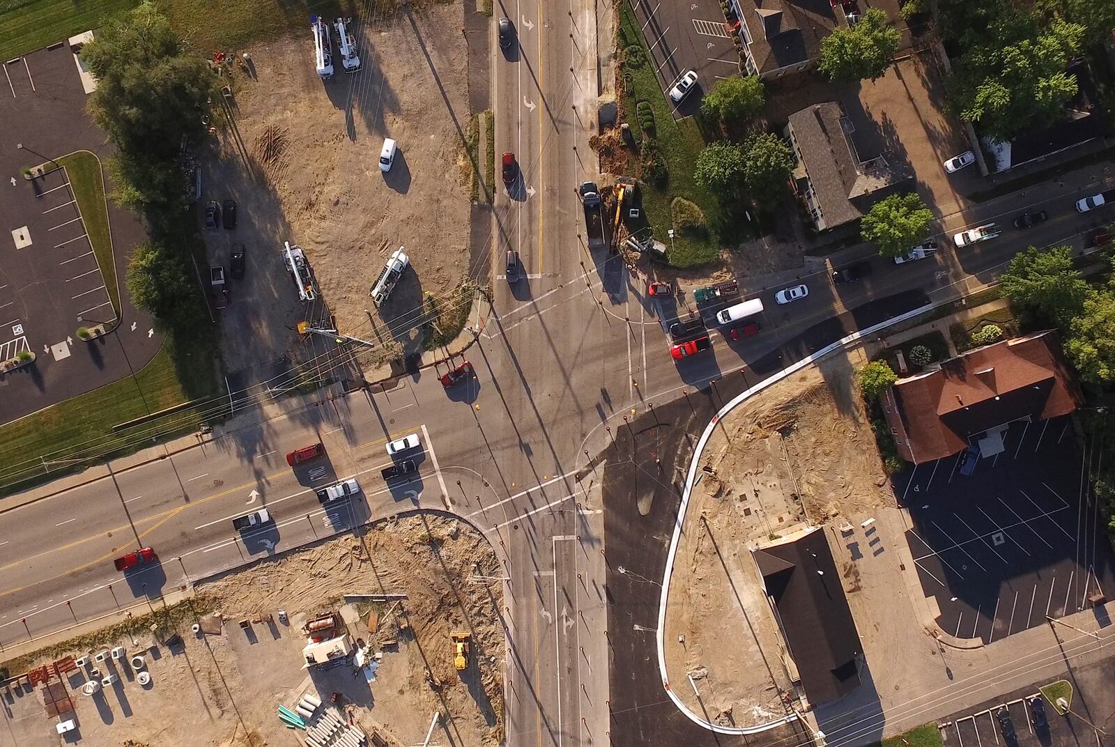 Downtown Springboro is transforming as an old shopping center is razed and a major intersection is widened.   TY GREENLEES / STAFF