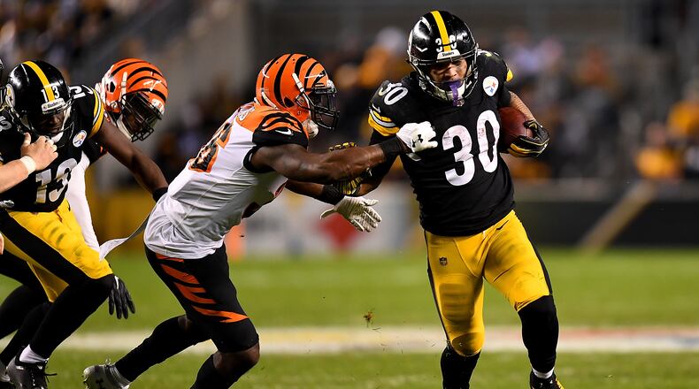 PITTSBURGH, PA - DECEMBER 30: James Conner #30 of the Pittsburgh Steelers carries the ball against the Cincinnati Bengals in the third quarter during the game at Heinz Field on December 30, 2018 in Pittsburgh, Pennsylvania. (Photo by Joe Sargent/Getty Images)