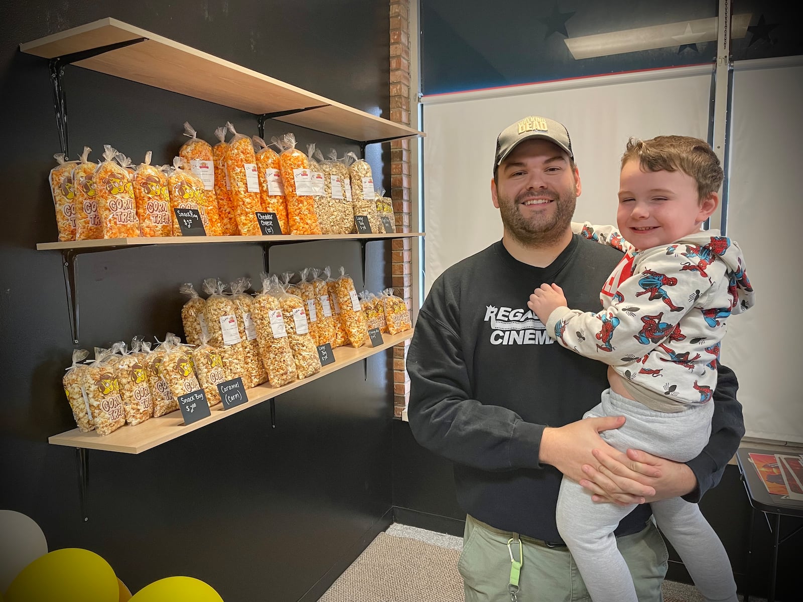 Cinematic Treats, a popcorn shop featuring five to eight rotating flavors each week, is located at 7111 Taylorsville Road in Huber Heights. Pictured is owner Luke Sowers and his son, Conner. NATALIE JONES/STAFF