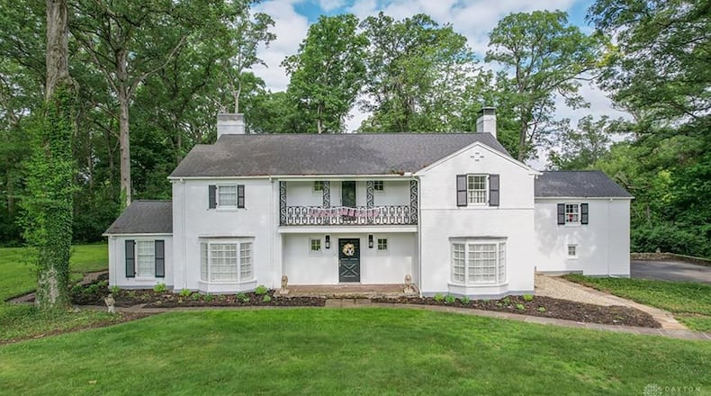 The front of the two-story home has a balcony over the front entry way, two bay windows and a two-car, side-entry garage. CONTRIBUTED PHOTOS