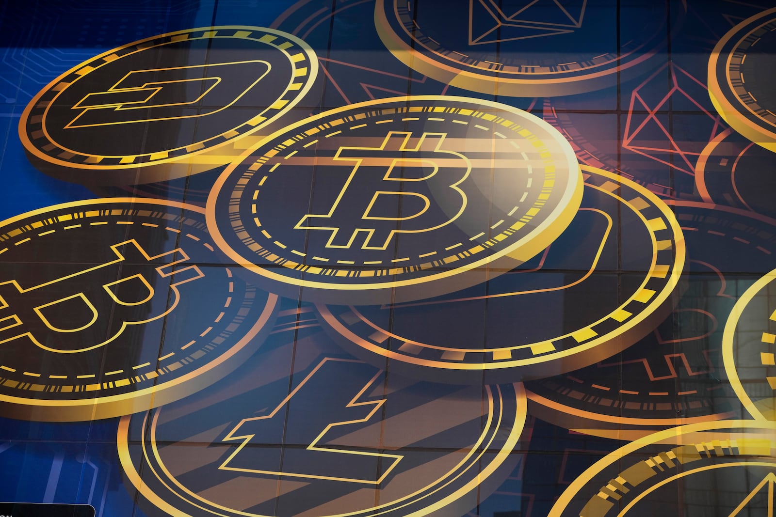 FILE - An advertisement for the cryptocurrency, Bitcoin, is displayed on a building in Hong Kong on Nov. 18, 2021. (AP Photo/Kin Cheung, File)