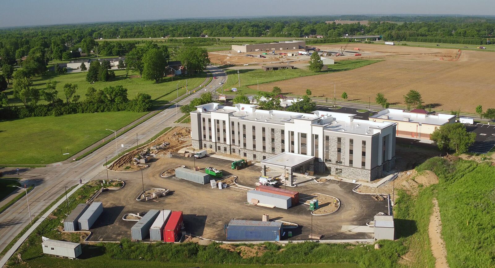 The Hampton Inn and Suites on South Progress Drive in Xenia directly behind two new retail centers including a Penn Station on Hospitality Drive.   TY GREENLEES / STAFF