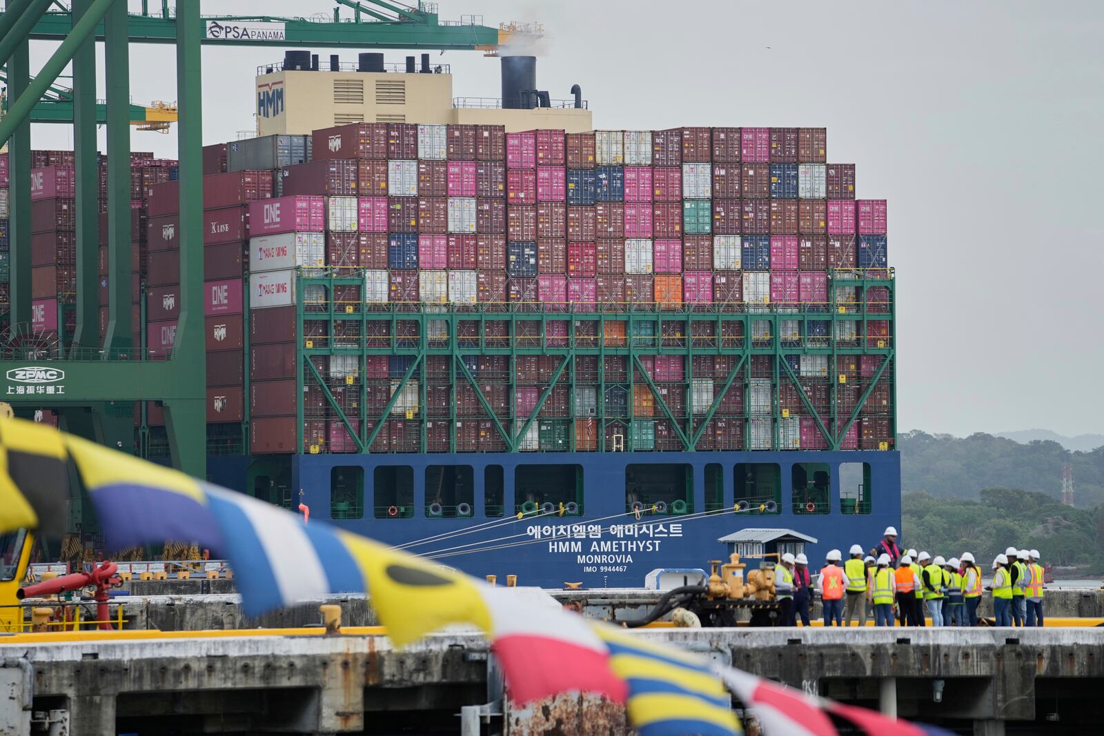 A cargo ship is loaded at the Port of Rodman in West Panama during the visit of U.S. Defense Secretary Pete Hegseth to the Panama Canal, Tuesday, April 8, 2025. (AP Photo/Matias Delacroix)