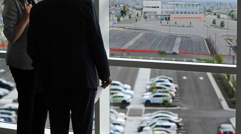 People look out over where the new behavioral health building at Dayton Children's Hospital will be located on their Valley Street campus. Death by suicide is the second leading cause of death for children and young adults between the ages of 10 and 34, and after a two-year decline, suicides are going up in Ohio, according to the Ohio Department of Health. Suicidal ideation is the main reason children are admitted at Dayton Children's Hospital. MARSHALL GORBY\STAFF